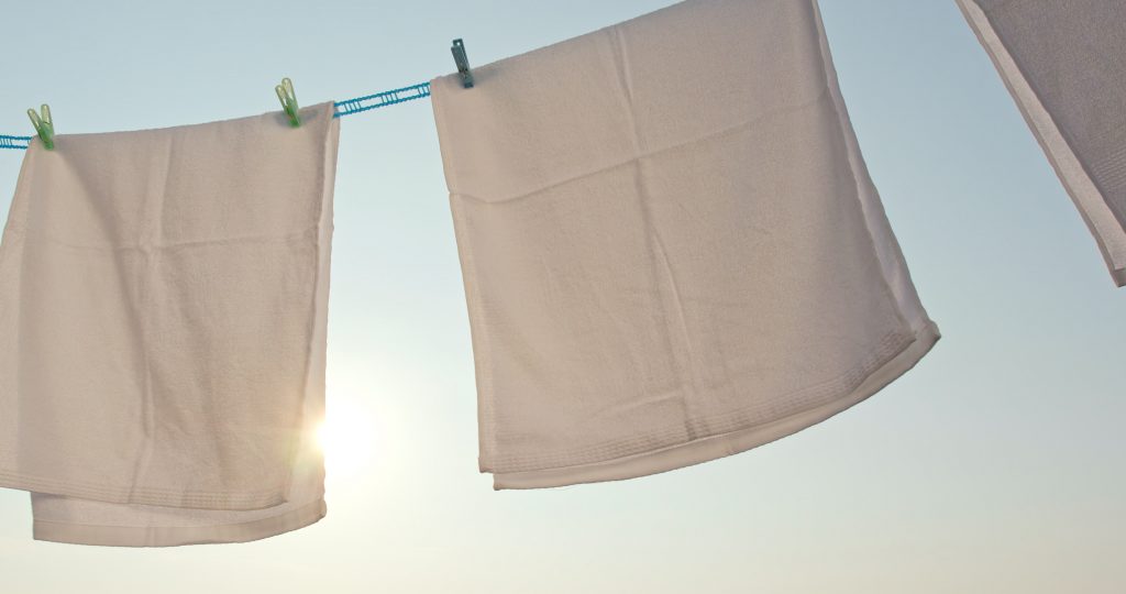 How should you dry towels?