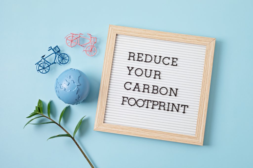 A frame with the text reduce your carbon footprint