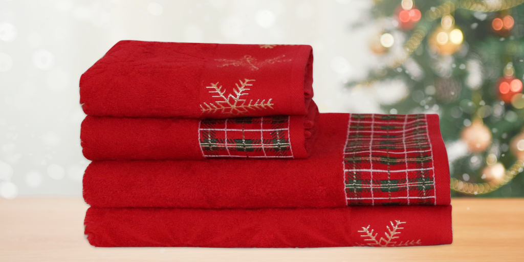 4 stacked Christmas themed towels
