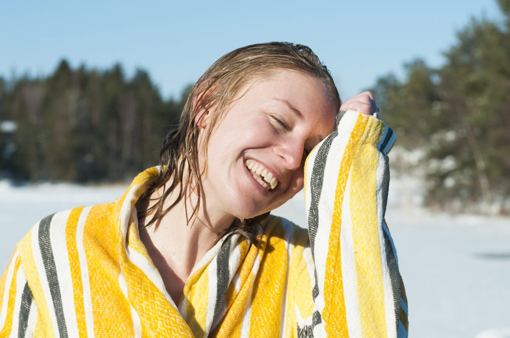 A young woman wearing a bathrobe