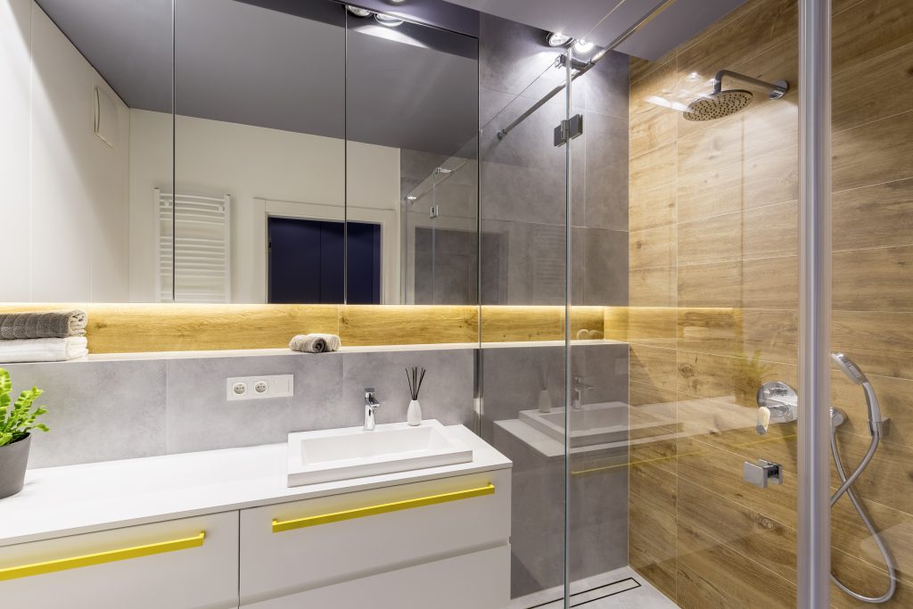 A bathroom with wood paneling